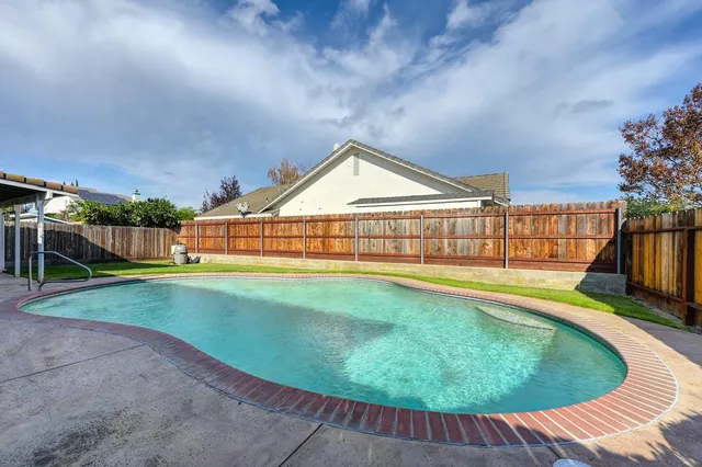 a view of swimming pool from a balcony