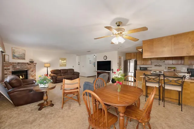 a view of a livingroom with furniture and a fireplace
