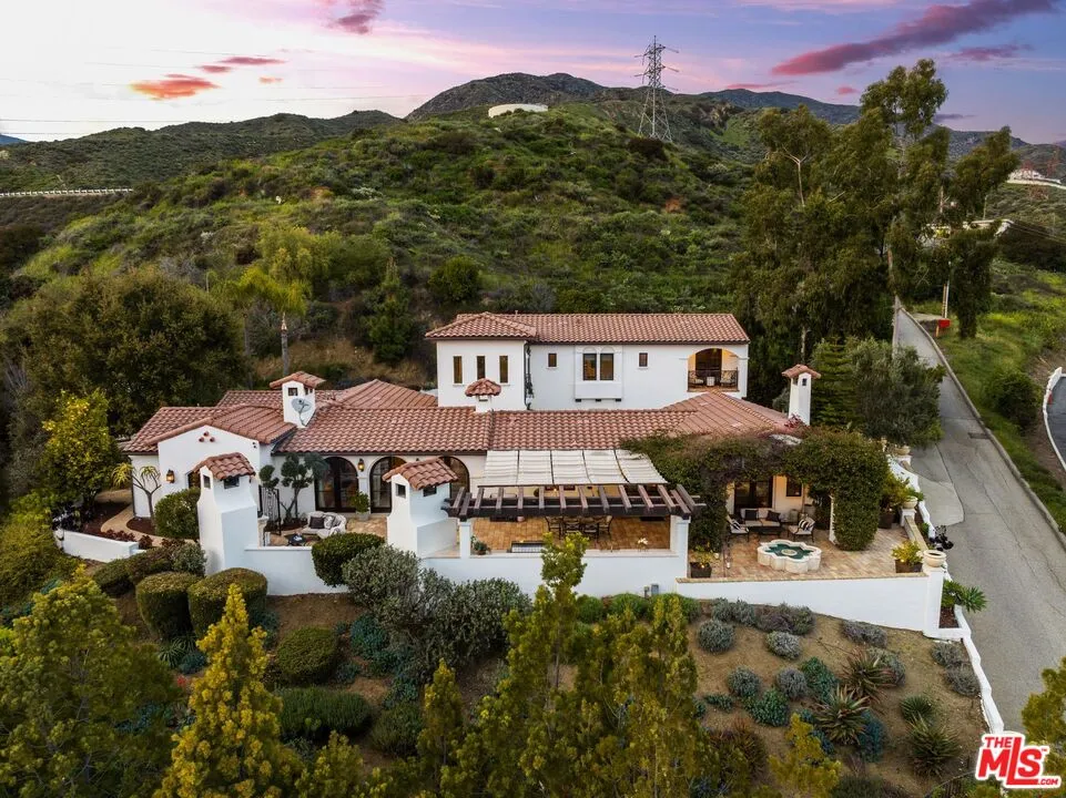 a view of house with outdoor space and patio