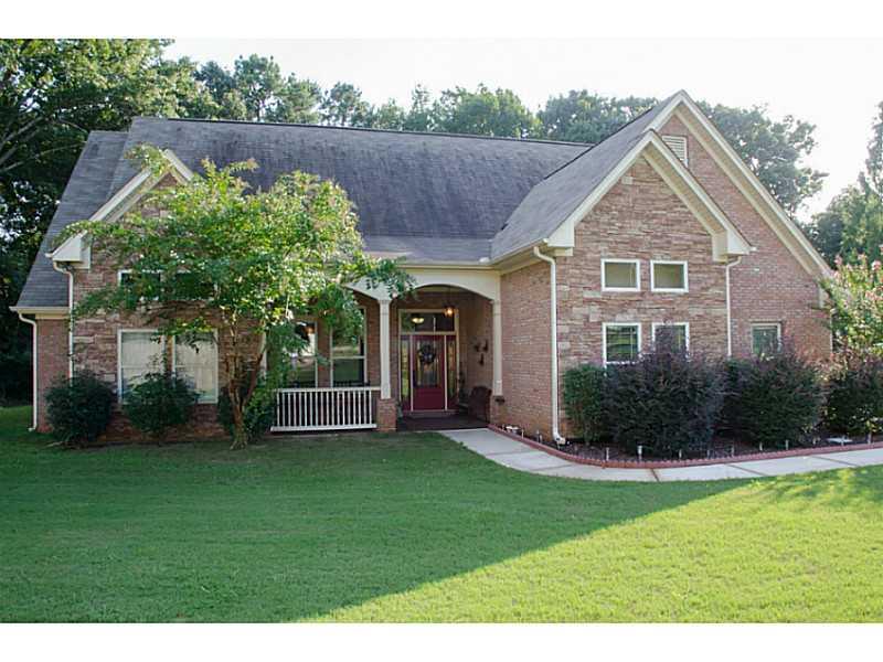557 Tom Smith Road Southwest Lilburn, GA 30047 - Photo 1 of 1 Exterior Front.