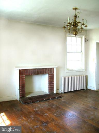 8602 Green Valley Road Union Bridge, MD 21791 - Photo 5 of 12 Dining room fireplace