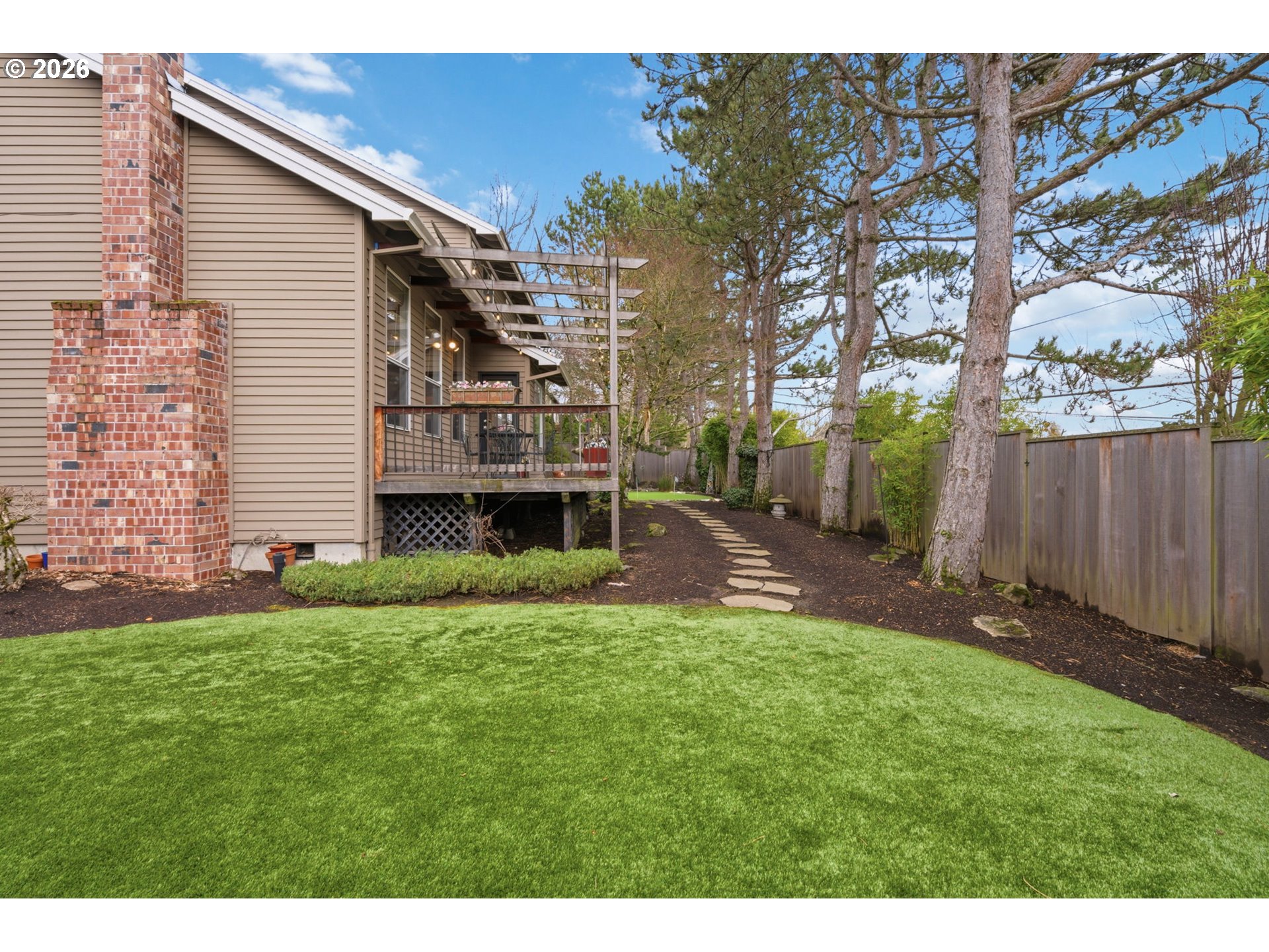 6108 Southwest Kruse Ridge Drive Portland, OR 97219 - Photo 40 of 42 a view of a house with a yard