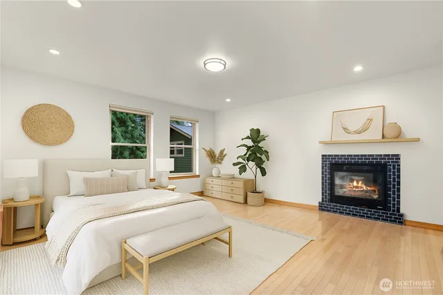 a bedroom with a bed and a fireplace