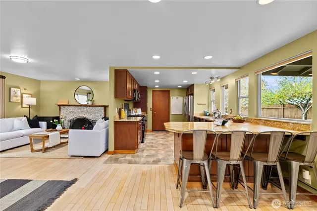 a large kitchen with a table and chairs
