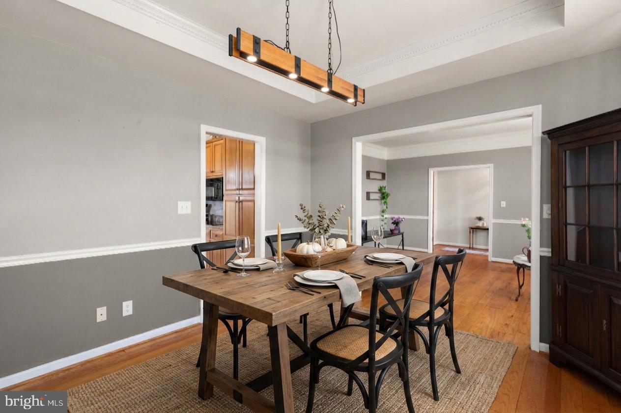2140 Marston Road New Windsor, MD 21776 - Photo 15 of 48 a view of a dining room with furniture and wooden floor