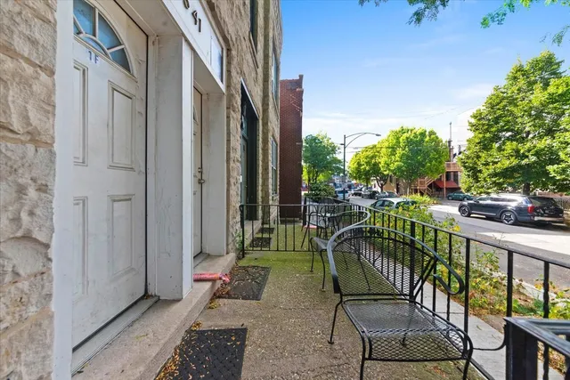 a view of balcony with furniture