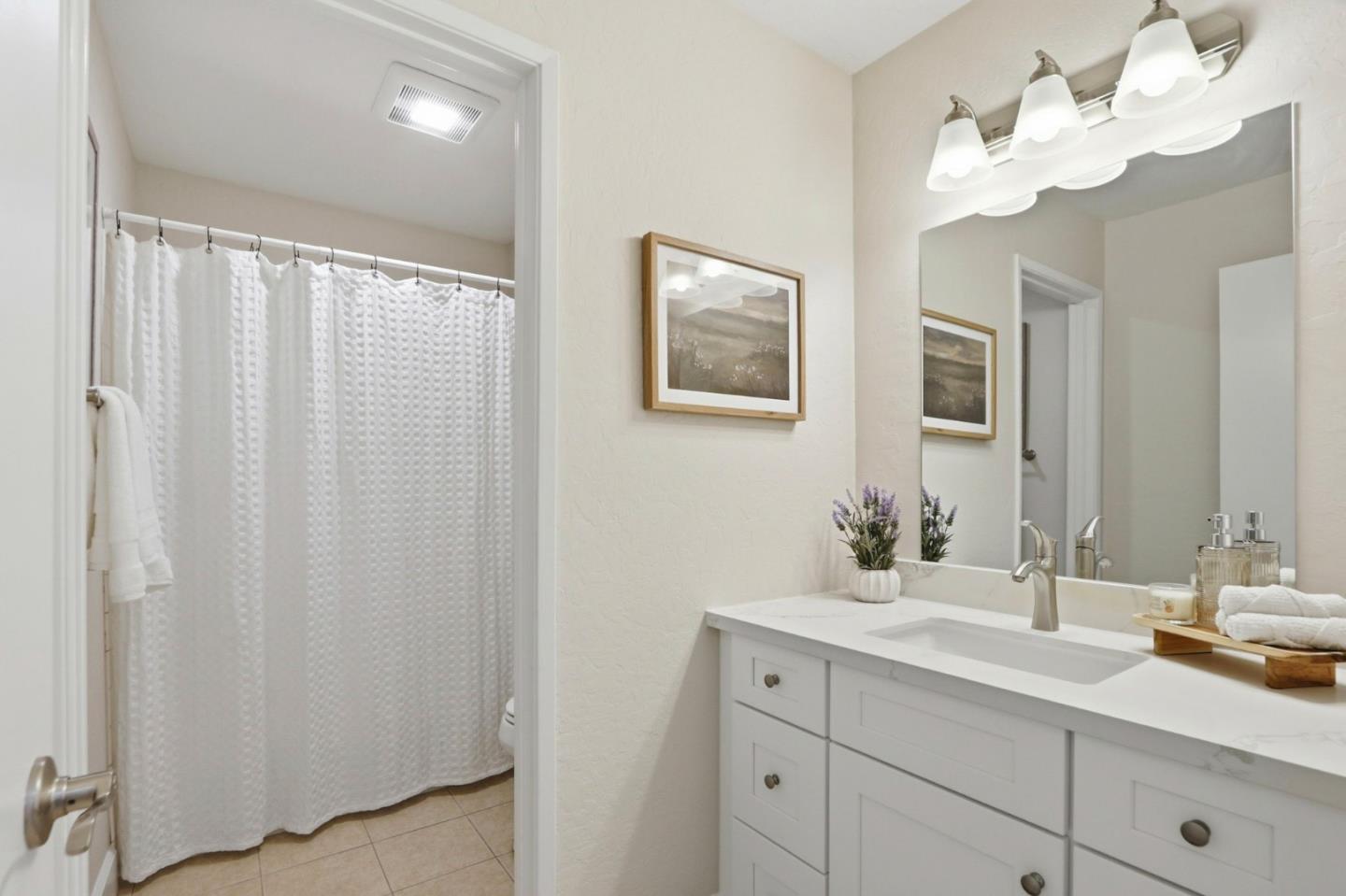 2252 Almaden Road, Unit A San Jose, CA 95125 - Photo 18 of 40 a bathroom with a double vanity sink and a mirror
