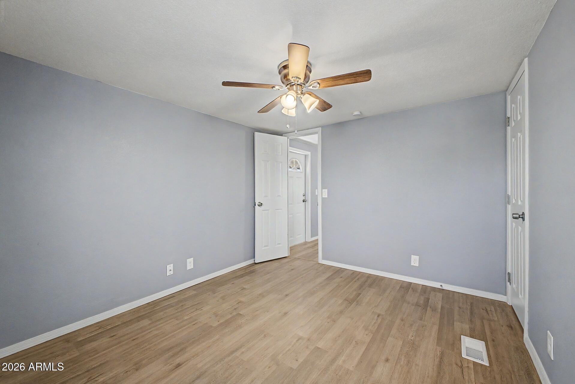 320 East McKellips Road, Unit 58 Mesa, AZ 85201 - Photo 14 of 22 wooden floor in an empty room