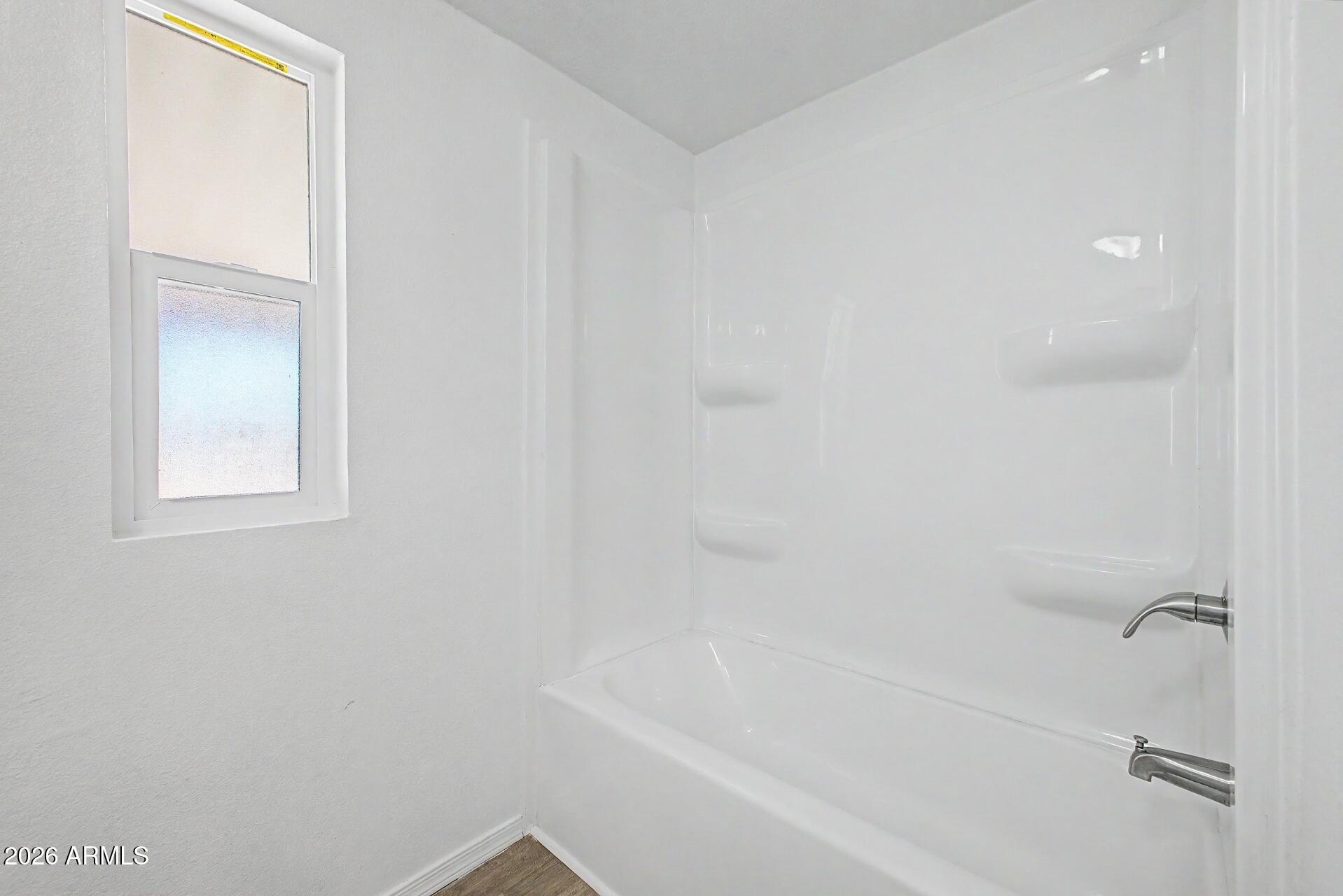 320 East McKellips Road, Unit 58 Mesa, AZ 85201 - Photo 17 of 22 a close up of a bathtub