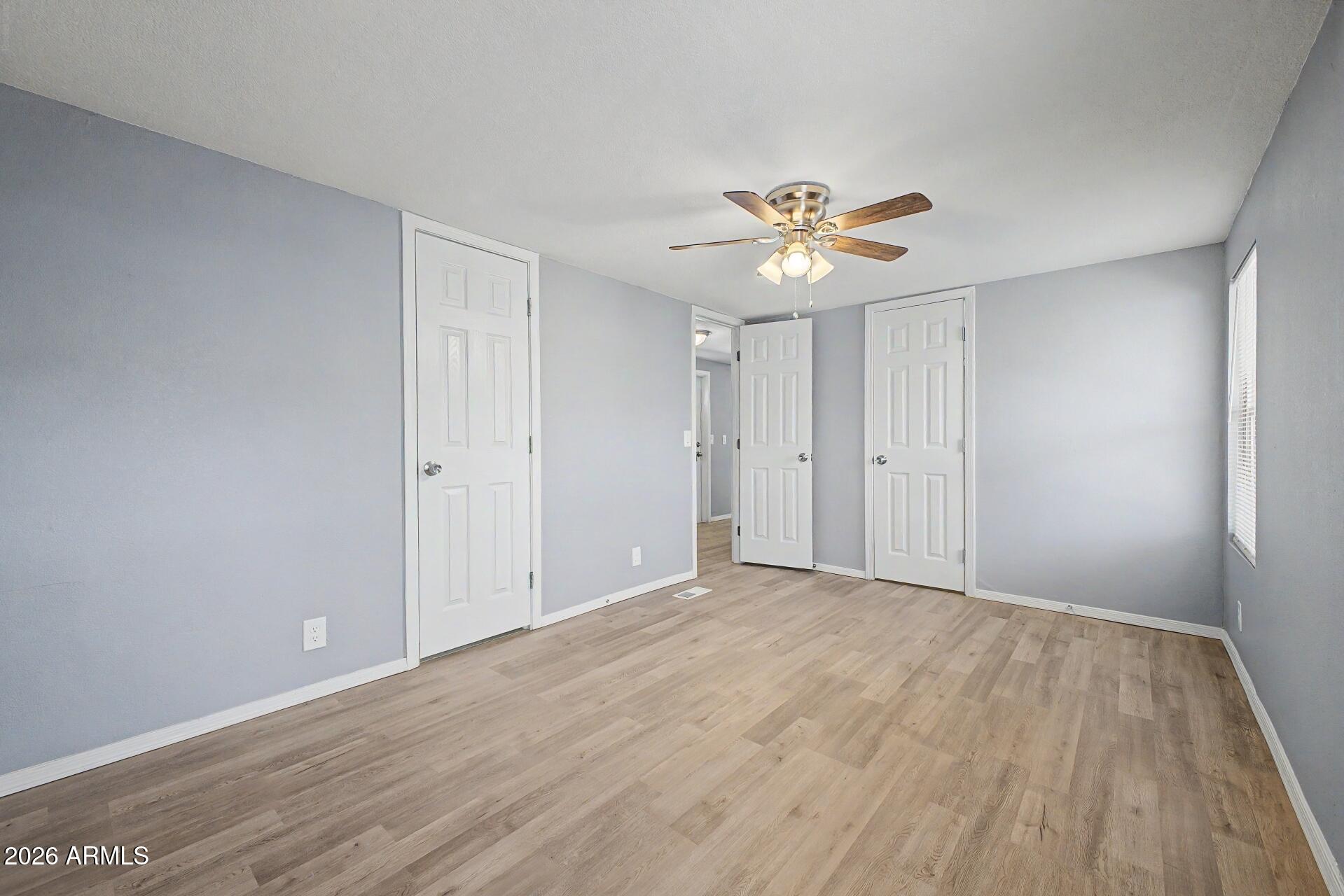 320 East McKellips Road, Unit 58 Mesa, AZ 85201 - Photo 19 of 22 a view of an empty room with a window
