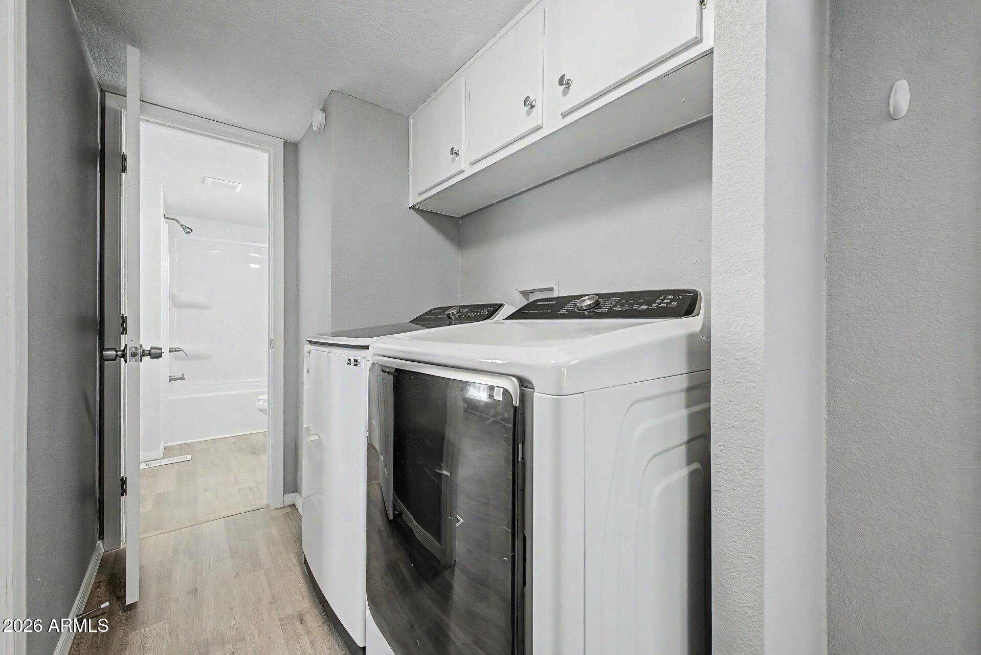 320 East McKellips Road, Unit 58 Mesa, AZ 85201 - Photo 22 of 22 a utility room with dryer and washer