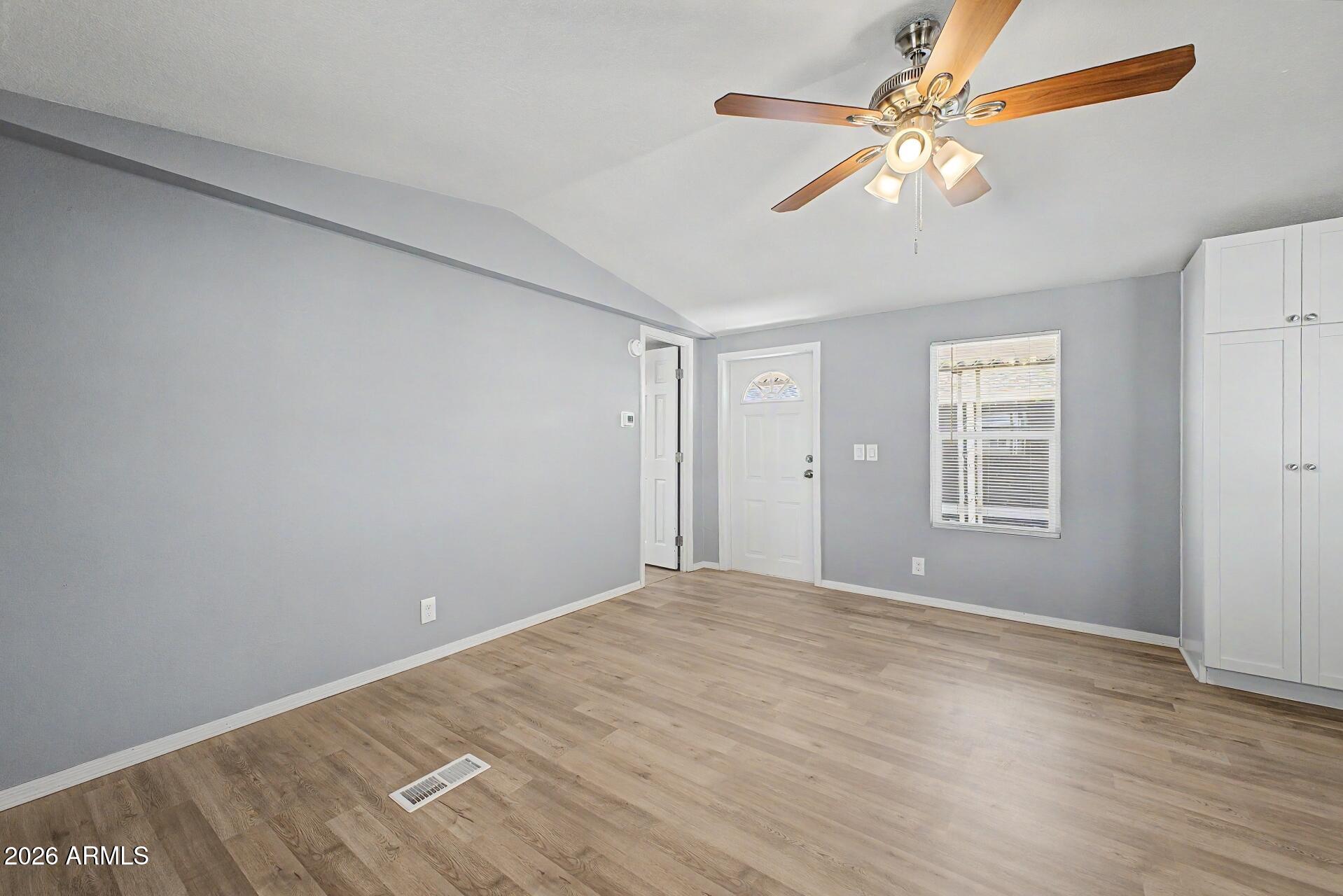 320 East McKellips Road, Unit 58 Mesa, AZ 85201 - Photo 6 of 22 a view of an empty room with a window
