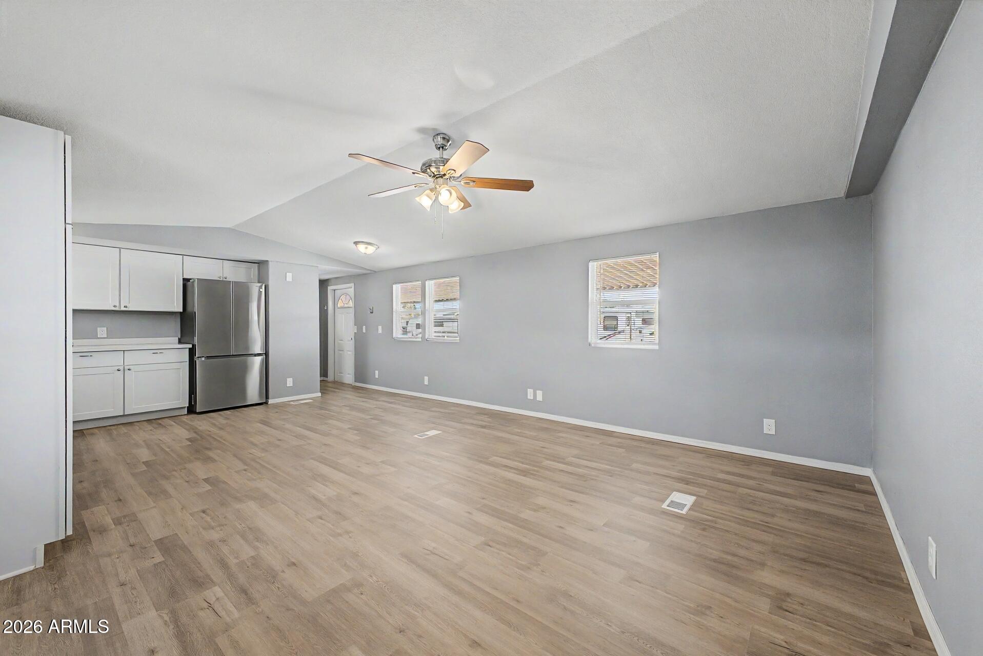 320 East McKellips Road, Unit 58 Mesa, AZ 85201 - Photo 7 of 22 a view of an empty room with a window