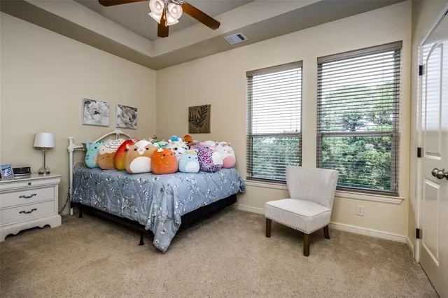 a bathroom with a granite countertop sink toilet and a mirror