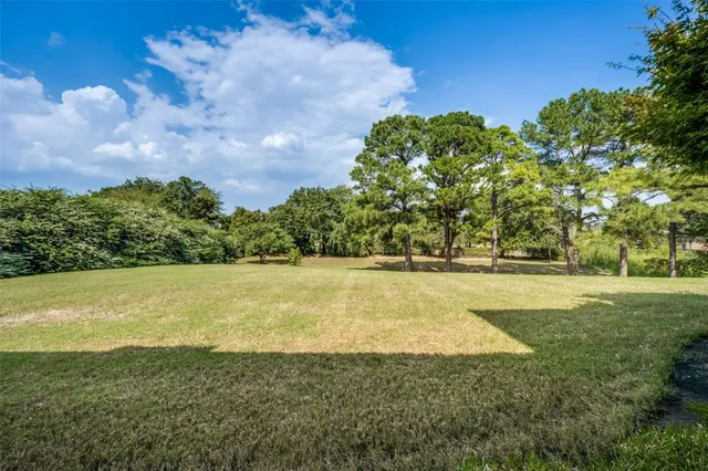 an aerial view of a house with a swimming pool