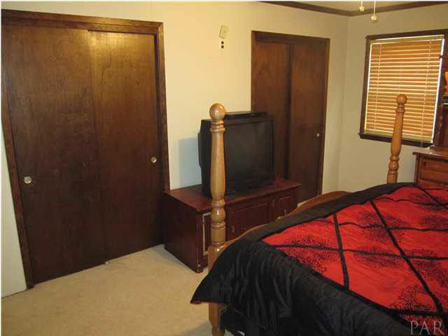 7863 Beneva Road Milton, FL 32583 - Photo 17 of 25 Master bedroom has 2 large closets.