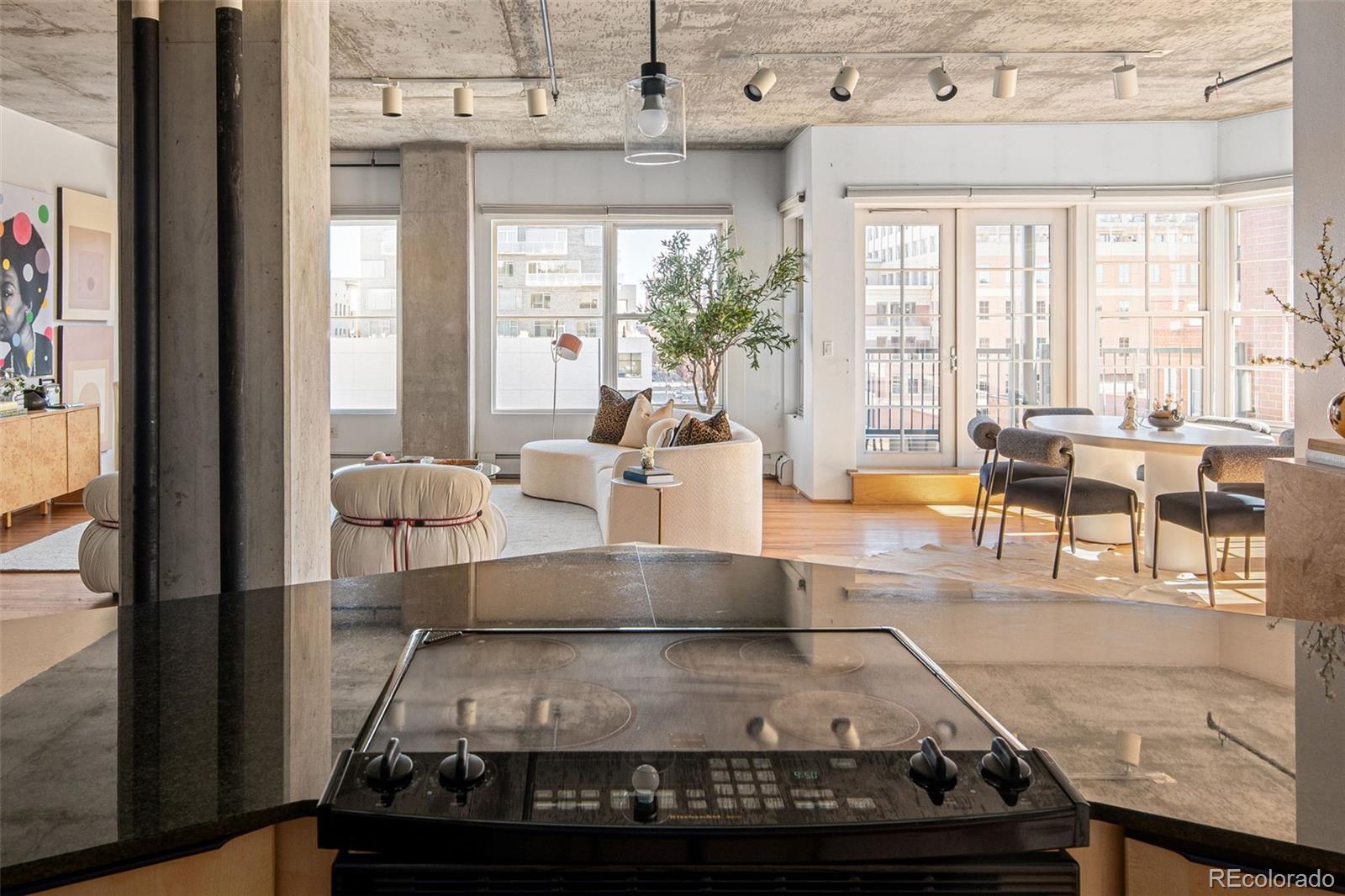 1499 Blake Street, Unit 6A Denver, CO 80202 - Photo 21 of 46 a living room with furniture and a large window