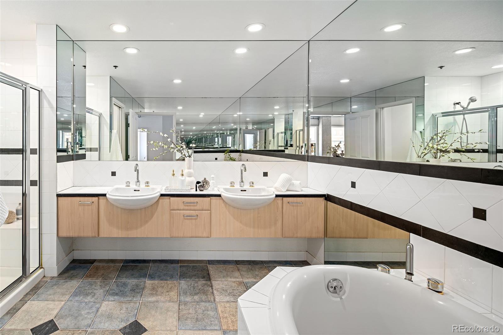 1499 Blake Street, Unit 6A Denver, CO 80202 - Photo 27 of 46 a large white kitchen with a large window