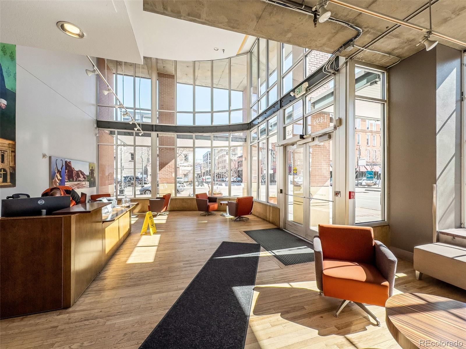 1499 Blake Street, Unit 6A Denver, CO 80202 - Photo 36 of 46 a living room with furniture and a large window