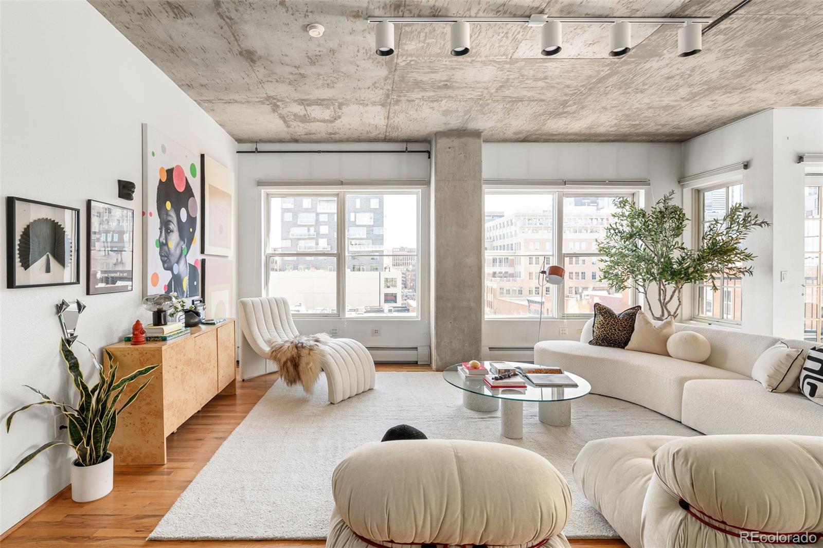 1499 Blake Street, Unit 6A Denver, CO 80202 - Photo 7 of 46 a living room with furniture and a large window