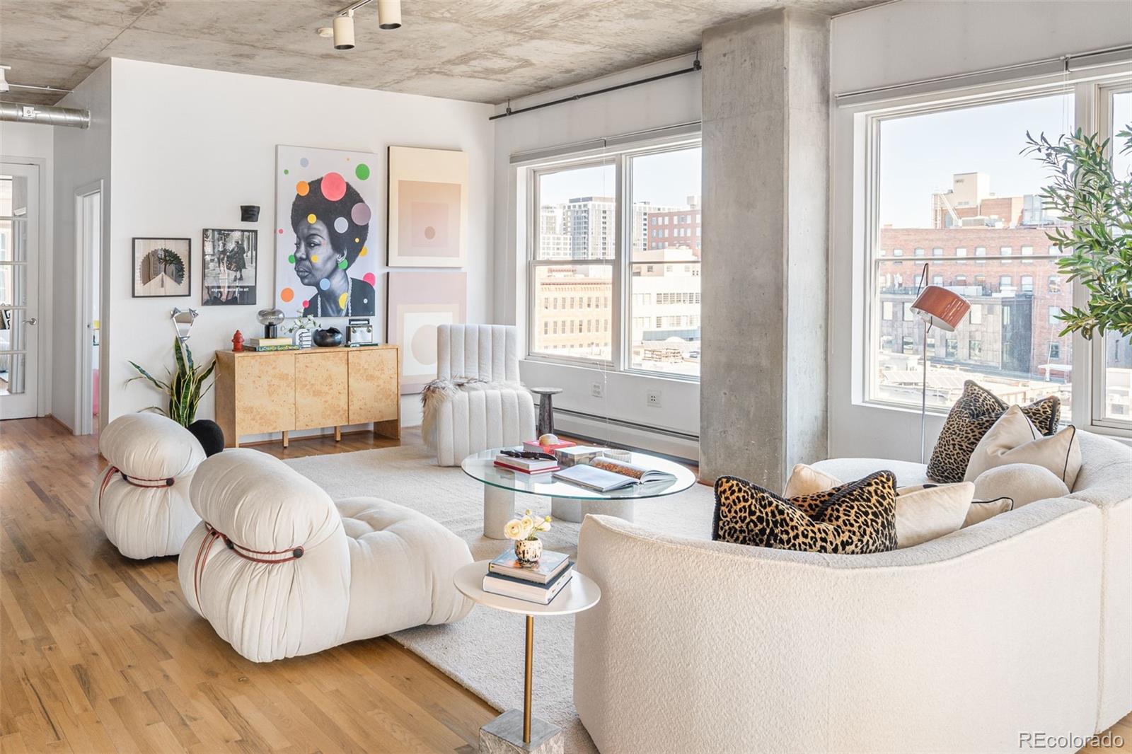 1499 Blake Street, Unit 6A Denver, CO 80202 - Photo 8 of 46 a living room with furniture and a large window
