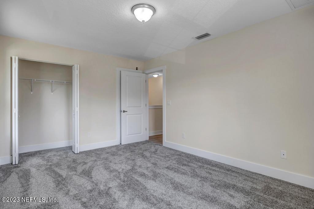 3666 Eunice Road Jacksonville, FL 32250 - Photo 27 of 32 an empty room with an entryway