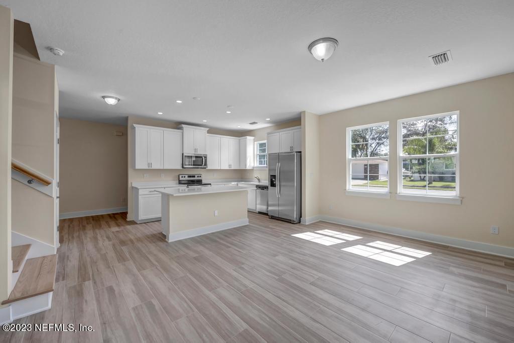 3666 Eunice Road Jacksonville, FL 32250 - Photo 7 of 32 a view of kitchen with wooden floor and electronic appliances