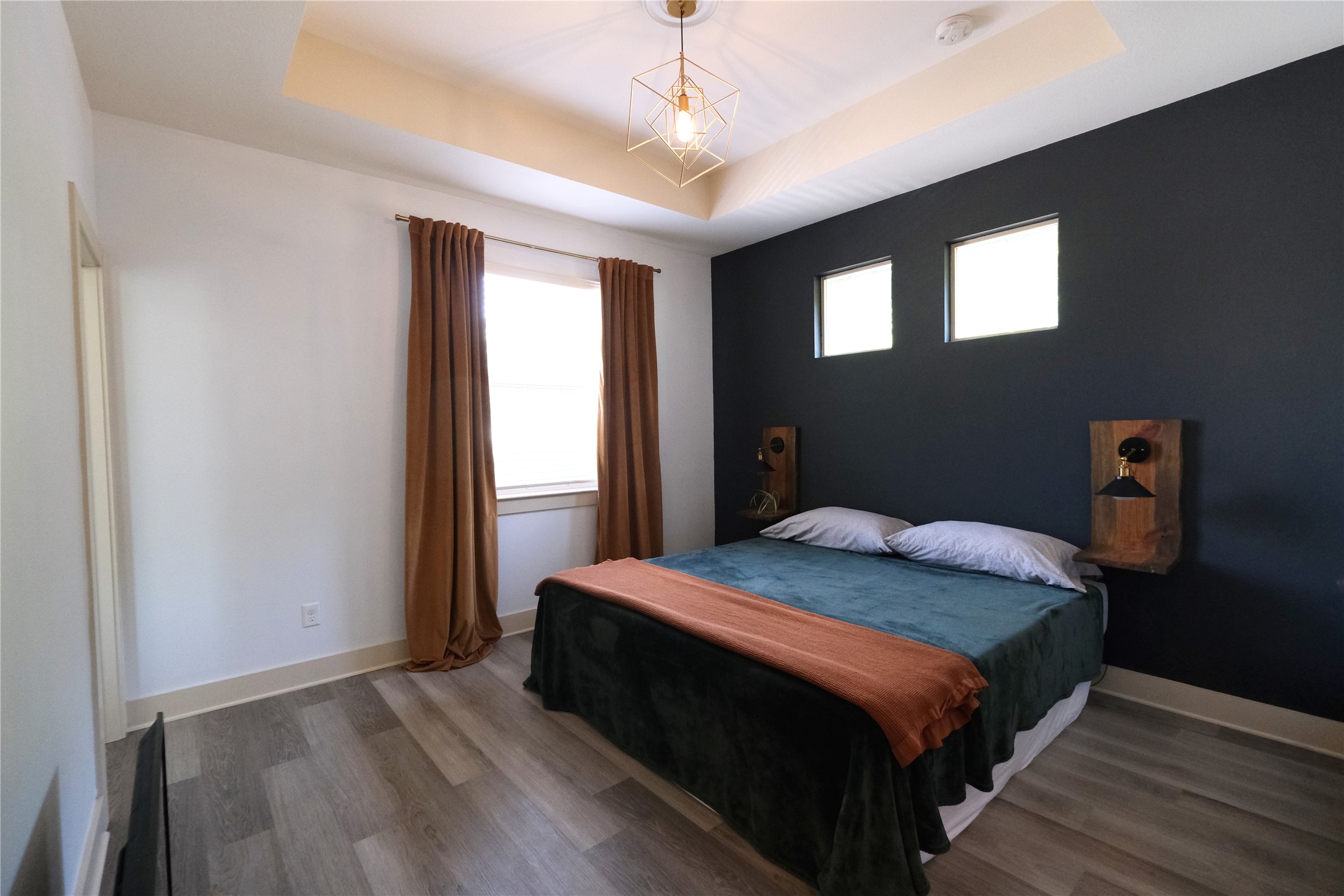 604 Allen Street, Unit 104 Austin, TX 78702 - Photo 9 of 16 a bedroom with a bed and a window