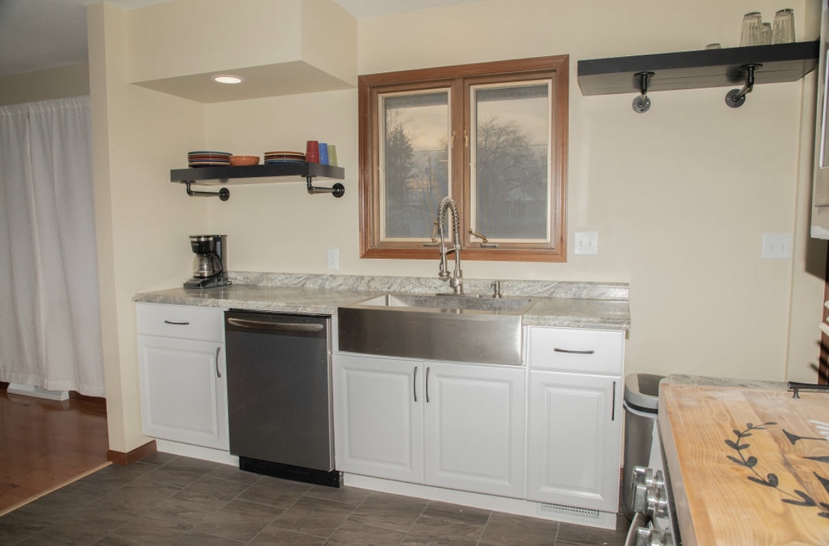 1004 Stockholm Road Paxton, IL 60957 - Photo 5 of 12 a kitchen with a sink and cabinets