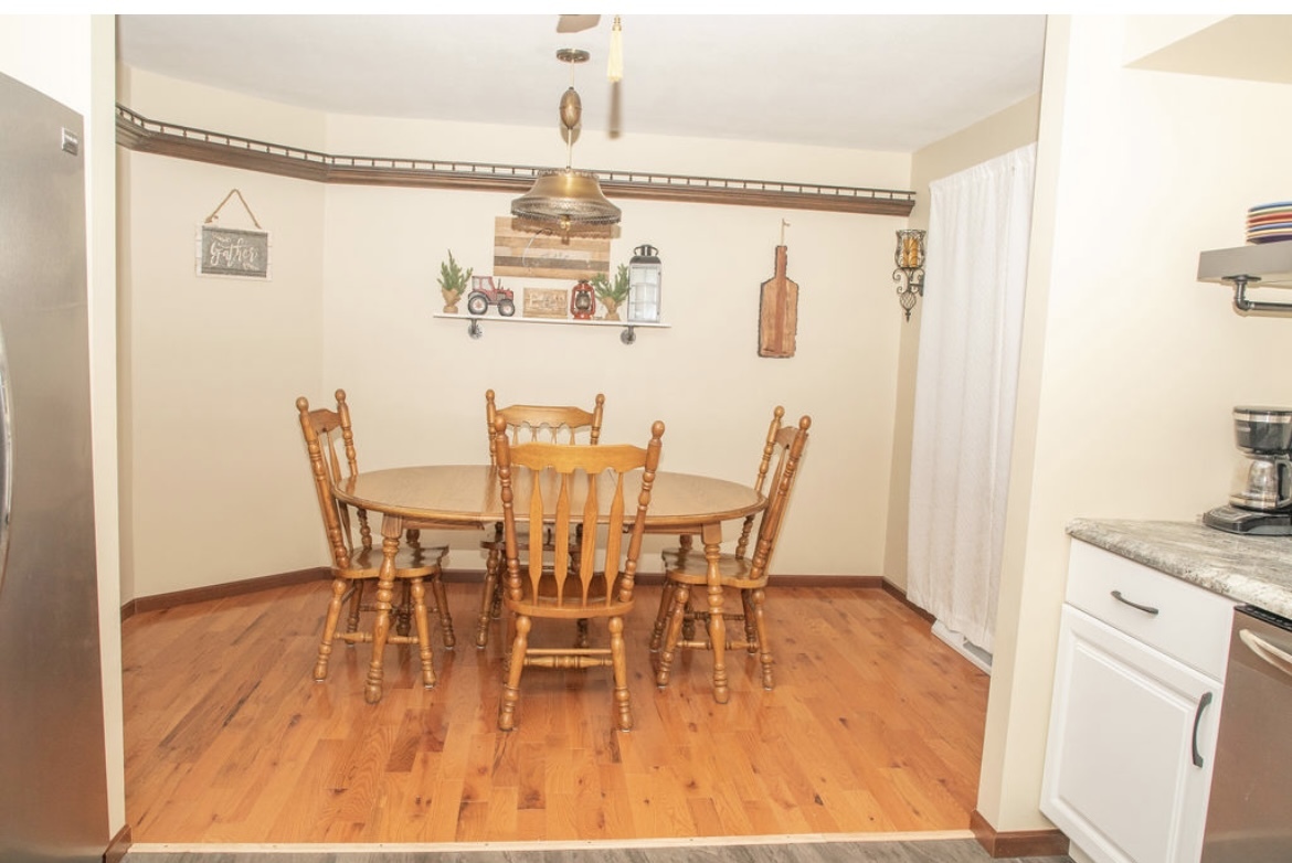 1004 Stockholm Road Paxton, IL 60957 - Photo 8 of 12 a dining room with furniture and wooden floor