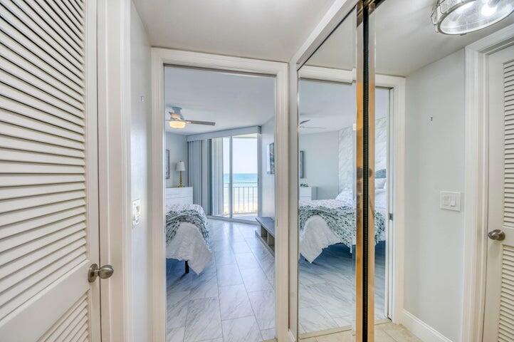 9600 South Ocean Drive, Unit 306 Jensen Beach, FL 34957 - Photo 23 of 36 a view of a hallway with wooden floor and bedroom