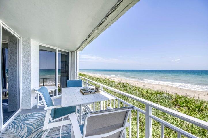 9600 South Ocean Drive, Unit 306 Jensen Beach, FL 34957 - Photo 5 of 36 a view of a balcony with furniture and wooden floor