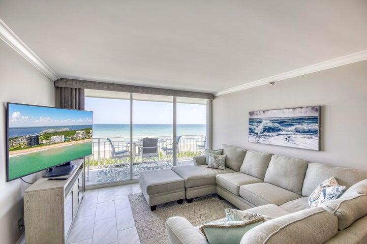 9600 South Ocean Drive, Unit 306 Jensen Beach, FL 34957 - Photo 8 of 36 a living room with furniture and a large window