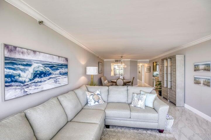 9600 South Ocean Drive, Unit 306 Jensen Beach, FL 34957 - Photo 10 of 36 a living room with furniture and a large window