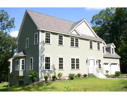 a view of house with yard