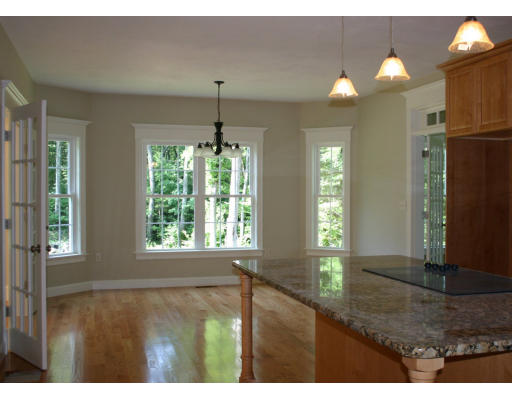 87 Lancaster County Road Harvard, MA 01451 - Photo 9 of 15 a view of an empty room and window and kitchen view