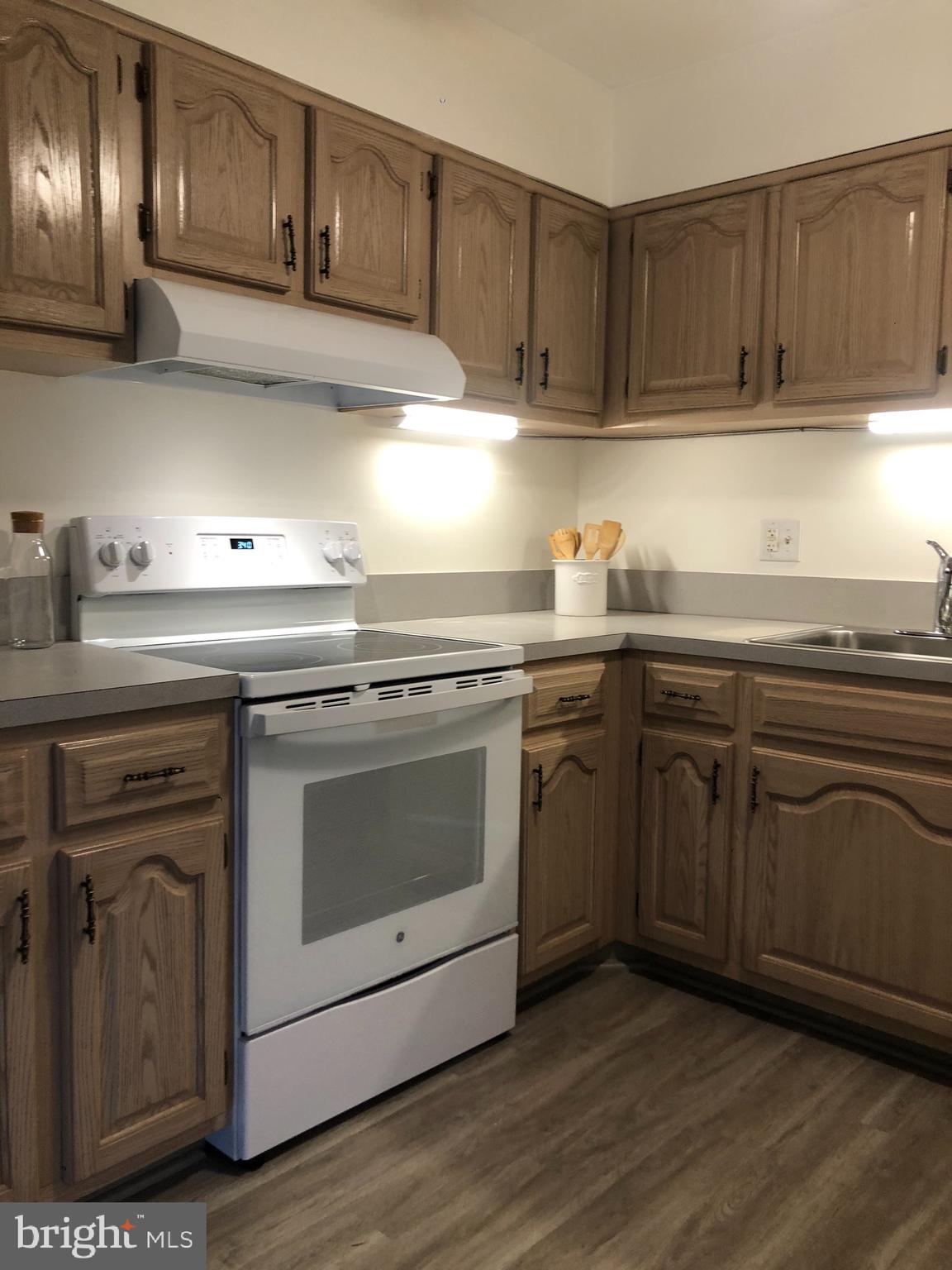6137 Edsall Road, Unit F Alexandria, VA 22304 - Photo 14 of 36 a kitchen with granite countertop stainless steel appliances and cabinets