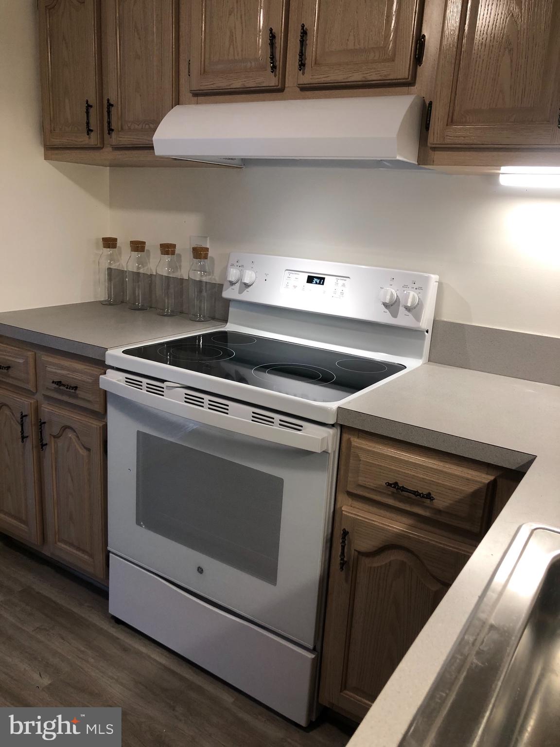 6137 Edsall Road, Unit F Alexandria, VA 22304 - Photo 15 of 36 a stove top oven sitting inside of a kitchen