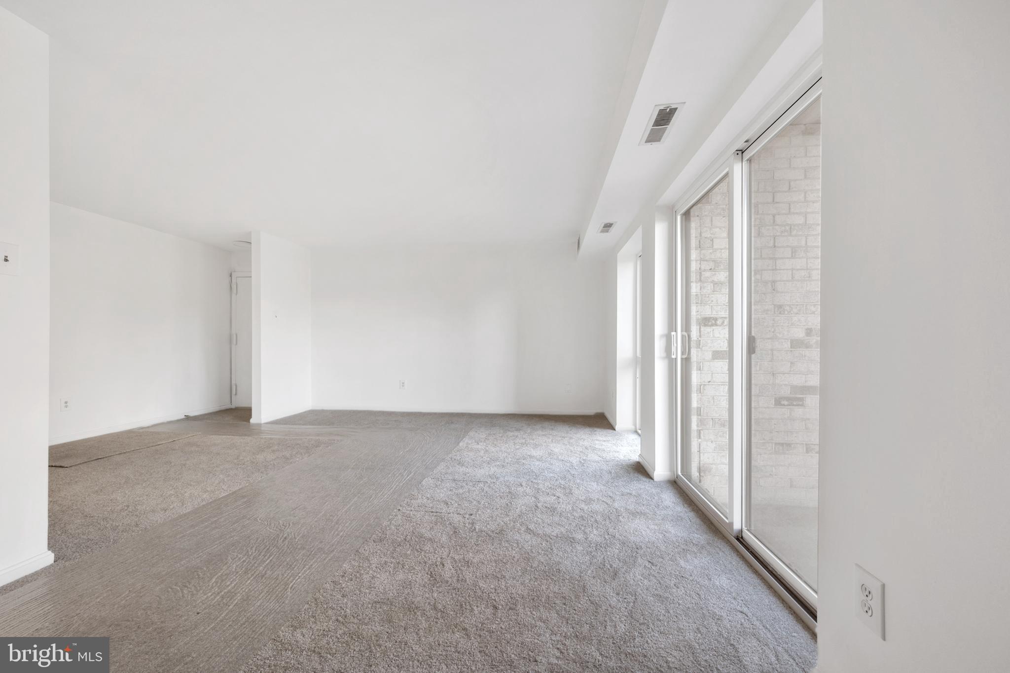 6137 Edsall Road, Unit F Alexandria, VA 22304 - Photo 3 of 36 a view of an empty room with a window