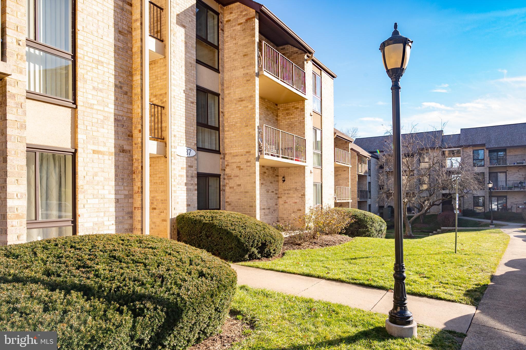 6137 Edsall Road, Unit F Alexandria, VA 22304 - Photo 23 of 36 a front view of a building with floor to ceiling windows