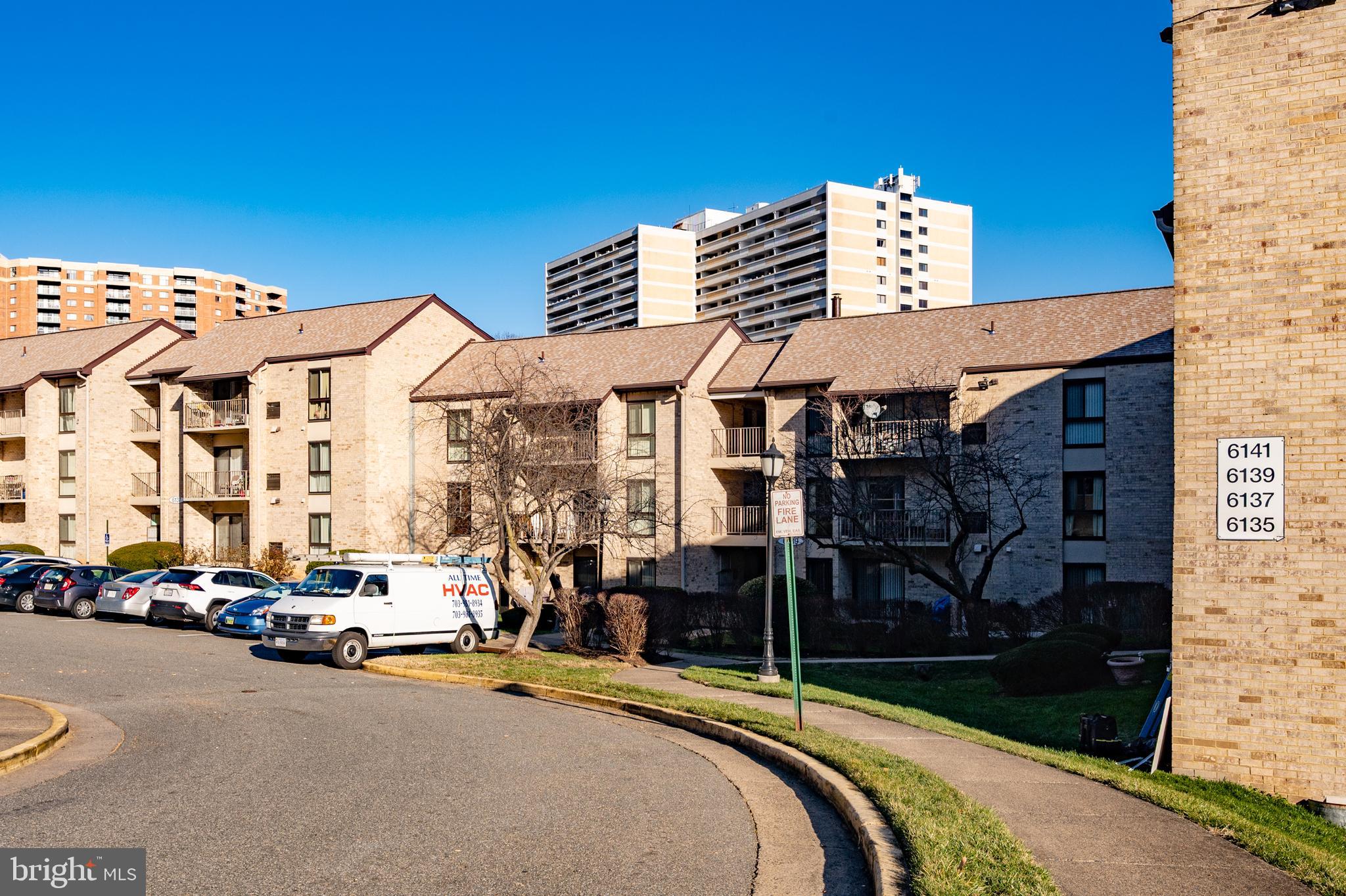 6137 Edsall Road, Unit F Alexandria, VA 22304 - Photo 29 of 36 a city street lined with parked cars and buildings