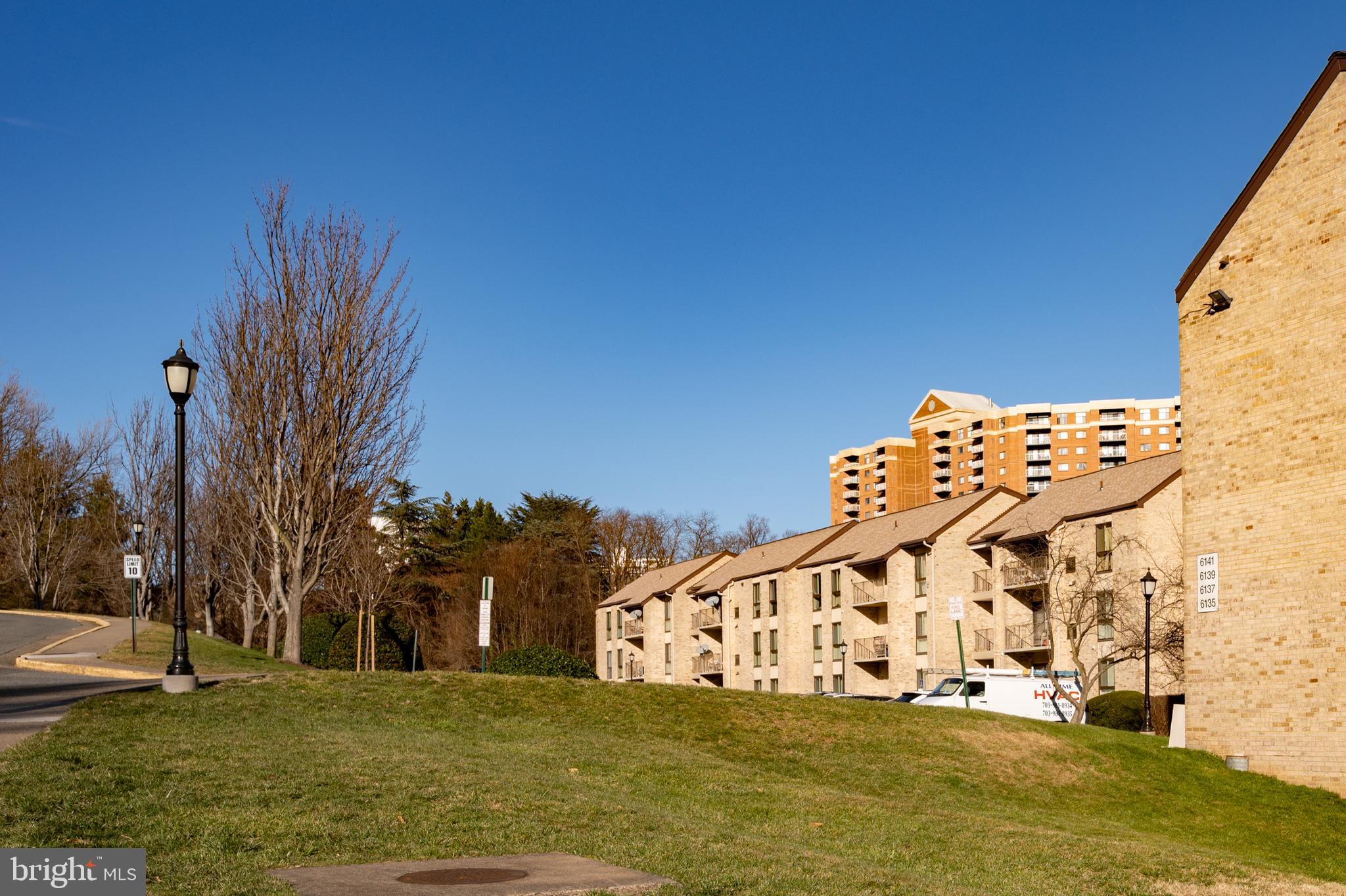 6137 Edsall Road, Unit F Alexandria, VA 22304 - Photo 30 of 36 a view of a big building with large trees