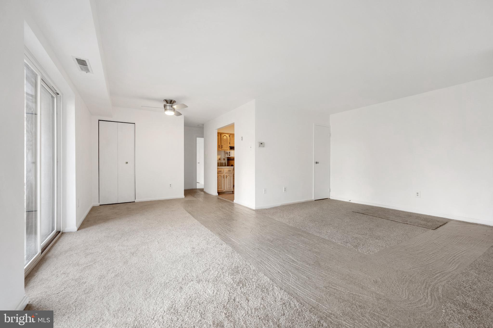 6137 Edsall Road, Unit F Alexandria, VA 22304 - Photo 4 of 36 an empty room with a natural light