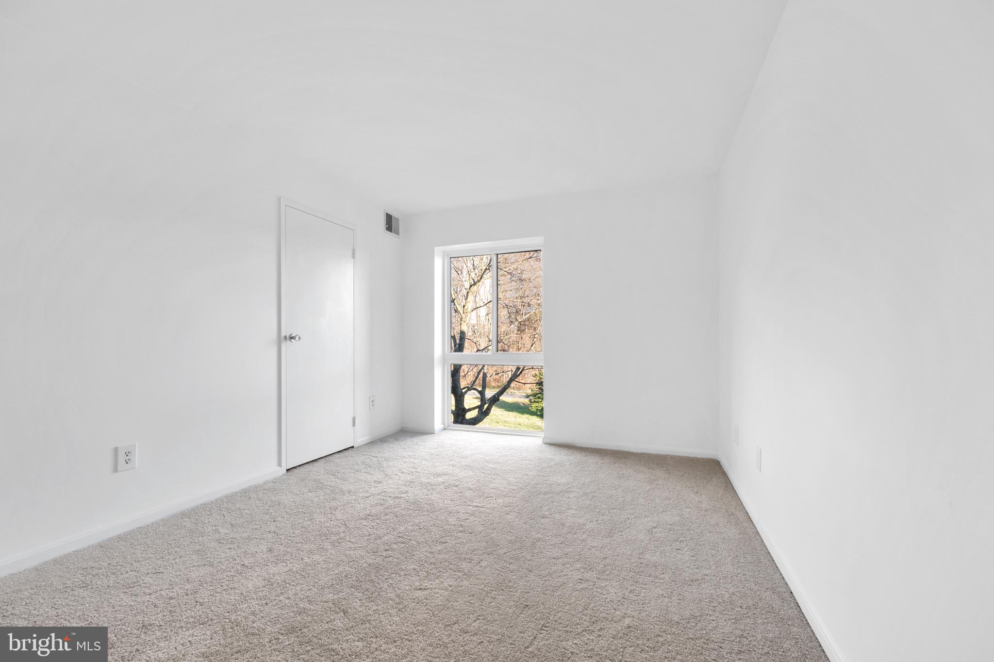 6137 Edsall Road, Unit F Alexandria, VA 22304 - Photo 7 of 36 a view of an empty room and window