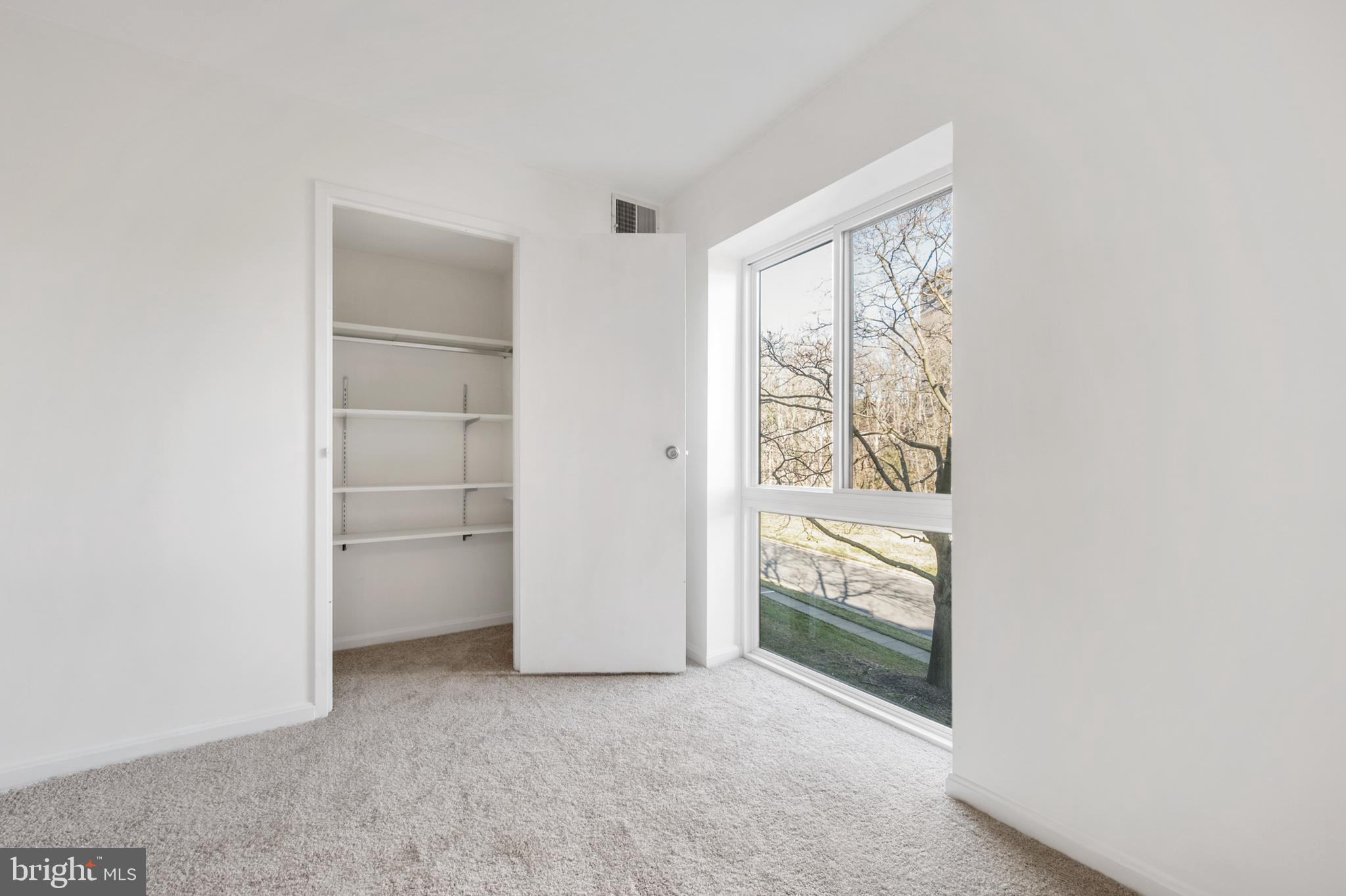 6137 Edsall Road, Unit F Alexandria, VA 22304 - Photo 10 of 36 an empty room with windows