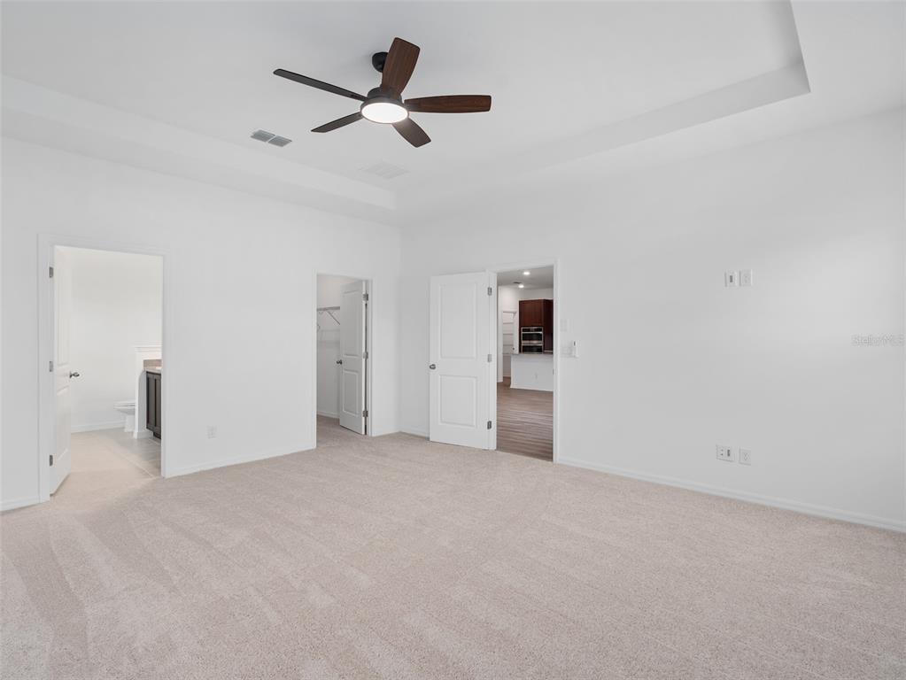 1122 Pearl Tree Road Deltona, FL 32725 - Photo 12 of 30 a view of a livingroom with a ceiling fan and window