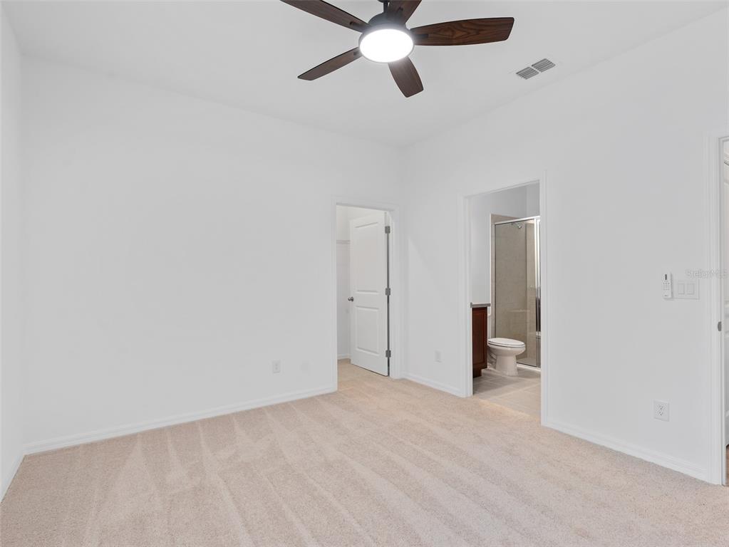 1122 Pearl Tree Road Deltona, FL 32725 - Photo 16 of 30 a view of empty room with a ceiling fan