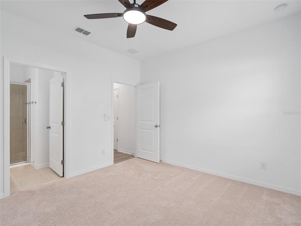 1122 Pearl Tree Road Deltona, FL 32725 - Photo 17 of 30 an empty room with closet and view