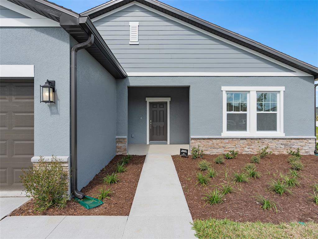 1122 Pearl Tree Road Deltona, FL 32725 - Photo 2 of 30 a front view of a house