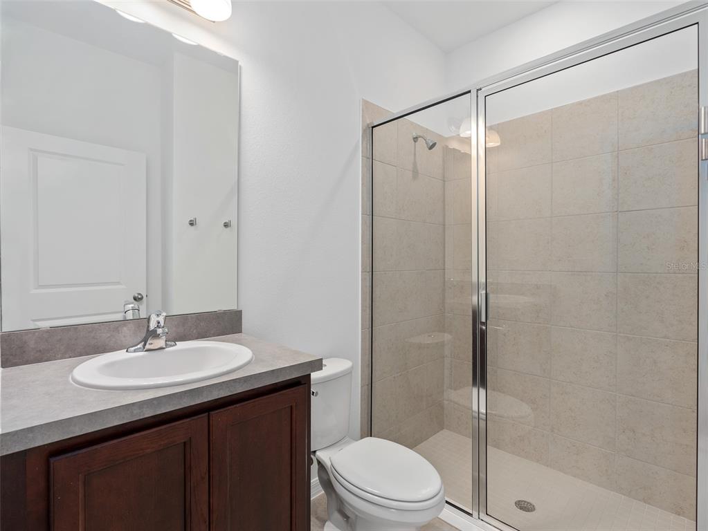 1122 Pearl Tree Road Deltona, FL 32725 - Photo 22 of 30 a bathroom with a sink a toilet and shower